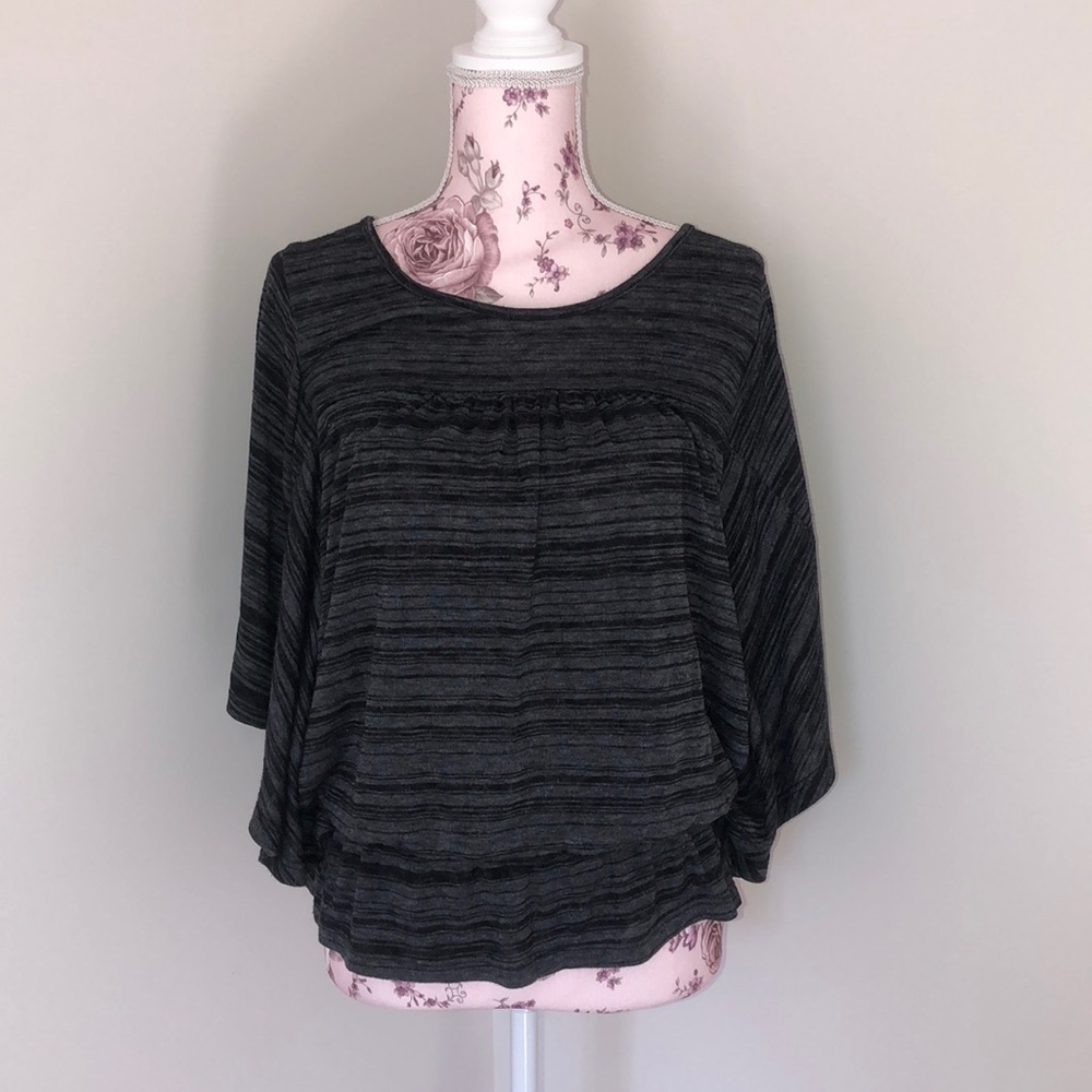 black and grey blouse.